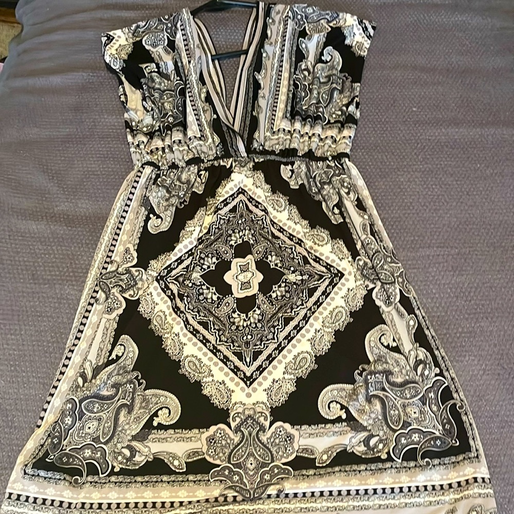 Super comfy dress! Or bathing suit cover, it is low cut